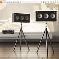 Black Speakers With Multiple Drivers On Tripods And Amplifier In Modern Room