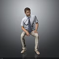Man Sitting On Dark Surface Wearing Light Blue Shirt Striped Tie And Khaki Pants