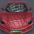 Red Sports Car With Sleek Body Black Wheels And Modern Front Design Features