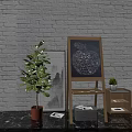 Easel Holding Apple Shaped Painting With Musical Instruments And Art Supplies Near White Brick Wall