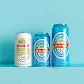Three Yanjing Beer Cans White Blue Light Blue On Light Blue Background Side By Side