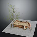 Small Tree With Green Leaves Next To Thatched Roof Cottage Model On Gray Gravel Ground