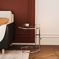 Modern Interior Side Table With Round Glass Top Metal Frame Beside Sofa On Wooden Floor