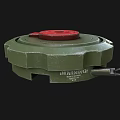 Green Circular Military Mine With Red Top Cover And Metal Ring Structure