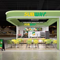 Subway Restaurant Green Kiosk Interior With Yellow Chairs Tables And Menu Boards