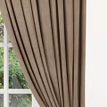 Brown Velvet Curtains Tied Back At White Window With Natural Greenery View