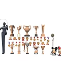 Collectible Trophies And Medals With Various Designs And Decorative Figurines