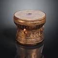 Golden Musical Instrument Drum With Artistic Carved Decorations And Ornamental Patterned Top