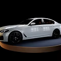 White Luxury Sedan With Modern Design Parked On Circular Display Platform 3d model