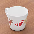 White Christmas Mug With Reindeer And Santa Claus Designs On Wooden Table