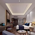 Modern Hotel Guest Room With Large Bed Blue Bedding TV Desk And Round Table