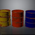 Three Colored Oil Drums Yellow Red Blue Rusty Metal Containers On Gray Background