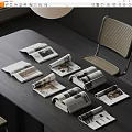 Arranged Open And Rolled Up Magazines On Dark Modern Table With Chair