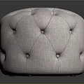 Round Tufted Ottoman With Light Fabric Upholstery And Simple Modern Design