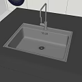 Stainless Steel Kitchen Sink In Modern Kitchen With Black Countertop And Faucet