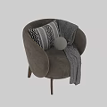 Beige Velvet Armchair With Geometric Pillow And Striped Blanket On Wooden Legs