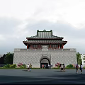 Ancient City Gate Tower With Traditional Green Tiled Roof Red Pillars And Arched Gateway