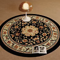 Round Area Rug Floral Pattern Black Base Beige Gold Accents with Mushroom Lamp and Open Book