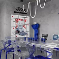 Modern Interior Space Featuring Transparent Chairs Blue Bases White Table Collectible Figures And Pendant Lights