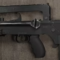 Black Tactical Rifle With Metal And Plastic Parts On Rough Concrete Surface