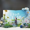 Summer Themed Photo Check In Spot With Blue Backdrop And Floral Decorations