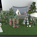 Outdoor Window Display With Teepee Tents Green Plants Pink Flowers And Decorative Lights