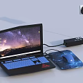 Modern Laptop Setup With Mouse Mouse Pad Power Adapter And Starry Sky Mountain Wallpaper