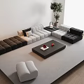 Modern Sectional Sofa Coffee Table Combination With Black White Gray Tones Potted Plant And Ottoman