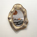 Golden Irregular Shaped Mirror Hanging On White Wall Reflecting Living Room Interior