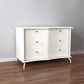 Modern White Console Side Cabinet With Drawers On Wooden Floor Against Gray Wall