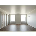 Cream White Hinged Doors With Decorative Panels In Light Wall Interior