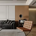 Modern Living Room Interior With Dark Sofa Blue Accent Chair And Glass Coffee Table