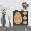 Black Console Cabinet With Rattan Door Panels Decorative Vases And Dried Flowers In Entryway