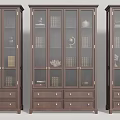Dark Brown Wooden Bookcases With Glass Doors Drawers And Books Globe Sculptures Vases