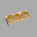 Three Tasty Donuts on White Tray Topped with Frosting and Crumbles