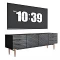 Black TV Stand with Textured Front Drawers and Wooden Legs Under TV Screen Displaying Time