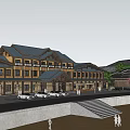 Scenic Commercial Street With Traditional Architecture Mountain View Waterfront And Pedestrian Walkway