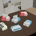 Various Packaged Tissues With Different Colors And Designs On Wooden Table