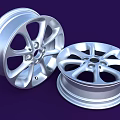 Two Silver Alloy Car Wheels With Modern Spoke Design And Shiny Finish