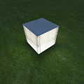 Cube Shaped Outdoor Light With Blue Top And White Striped Design On Green Grass
