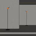 Modern Minimalist Floor Lamps With Black Pole And White Shade Illuminating Simple Indoor Setting