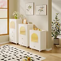 White Dressers With Yellow Arched Details By Window And Plant Paintings On Wall
