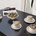 Delicious Latte Coffee With Art And Cupcakes On Dessert Stand At Table