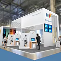 Marpacel Modern Exhibition Booth With White Design Interactive Displays Multiple Screens And People Around
