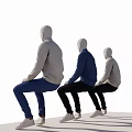 Sitting Mannequins Wearing Blue Beige Sweaters Black Blue Pants And White Sneakers