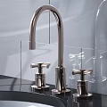 Modern Stainless Steel Kitchen Faucet with Curved Spout and Dual Handles on Black Countertop