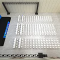 Indoor Event Venue With Stage Arranged Seats And Large Screen