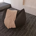 Modern Black Bean Bag Chair With Light Blanket On Wooden Floor And Light Walls