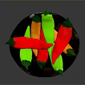 Colorful Chili Peppers On Black Plate With Red Green And Orange Varieties