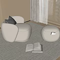 White Accent Chair With Gray Cushion And Ottoman On Light Rug Near Window With Books